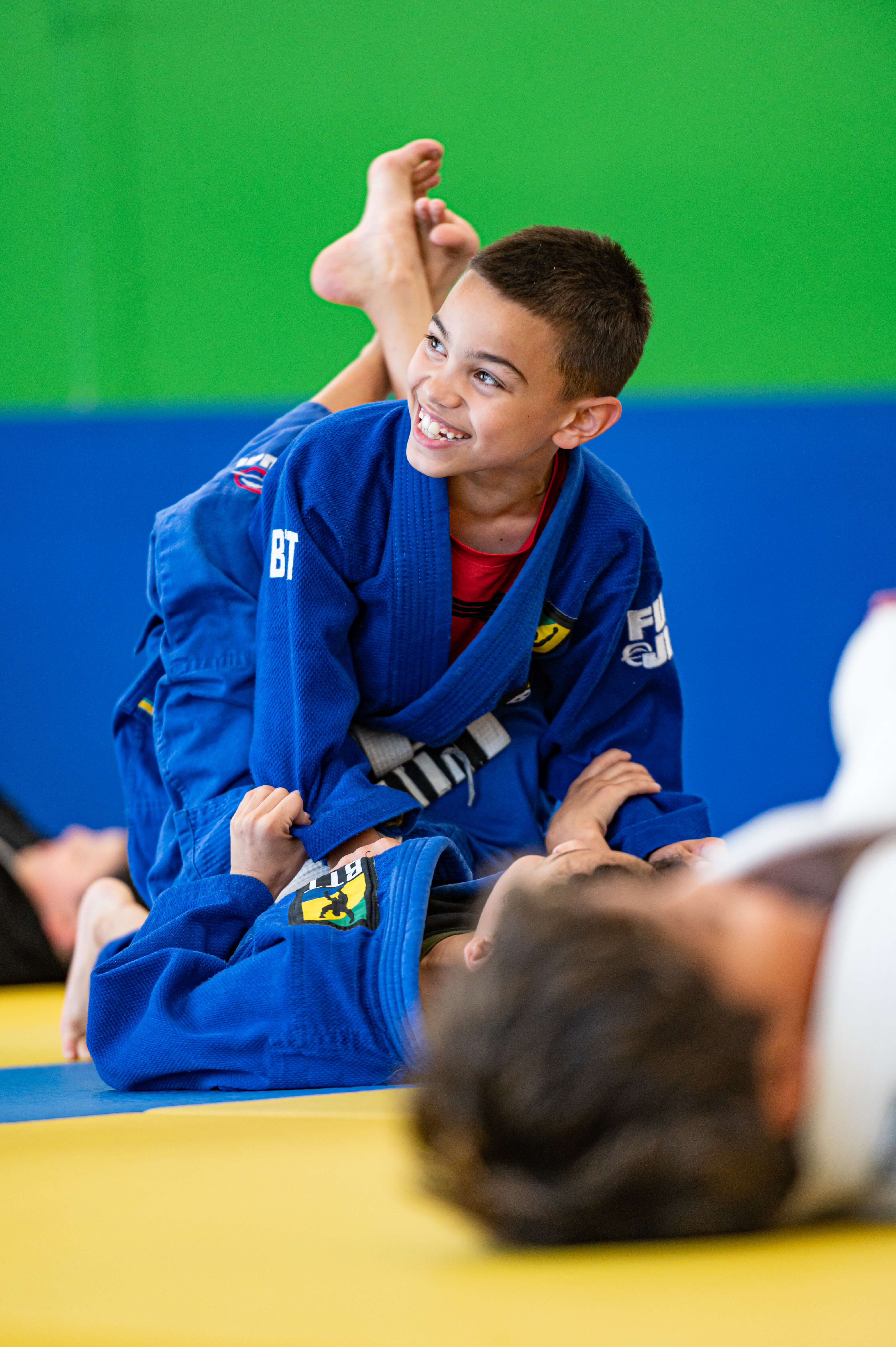 Young student smiling during kids Jiu-Jitsu class at BTT Irving